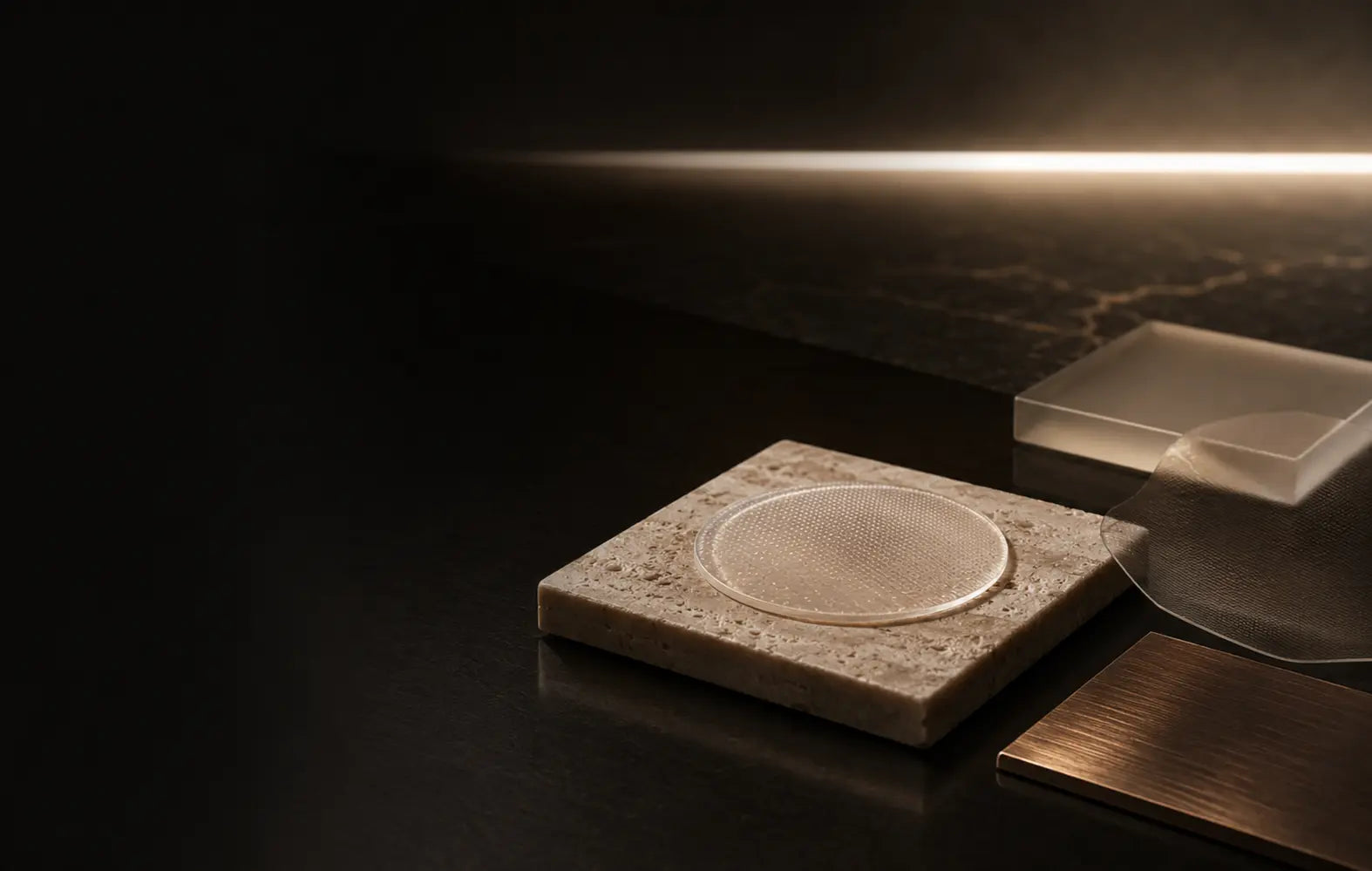 A translucent circular skincare patch studied with bronze and mineral material samples